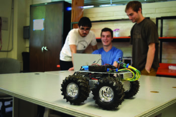 Three students with robot car