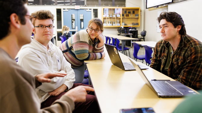 students talking in a classroom